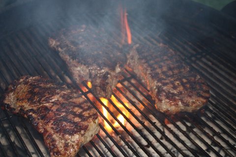 grilling_prime_steaks_on_grill_smoking_3